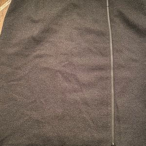 A chic black tweed-y skirt that is super flattering. Zipper detail, knee length.